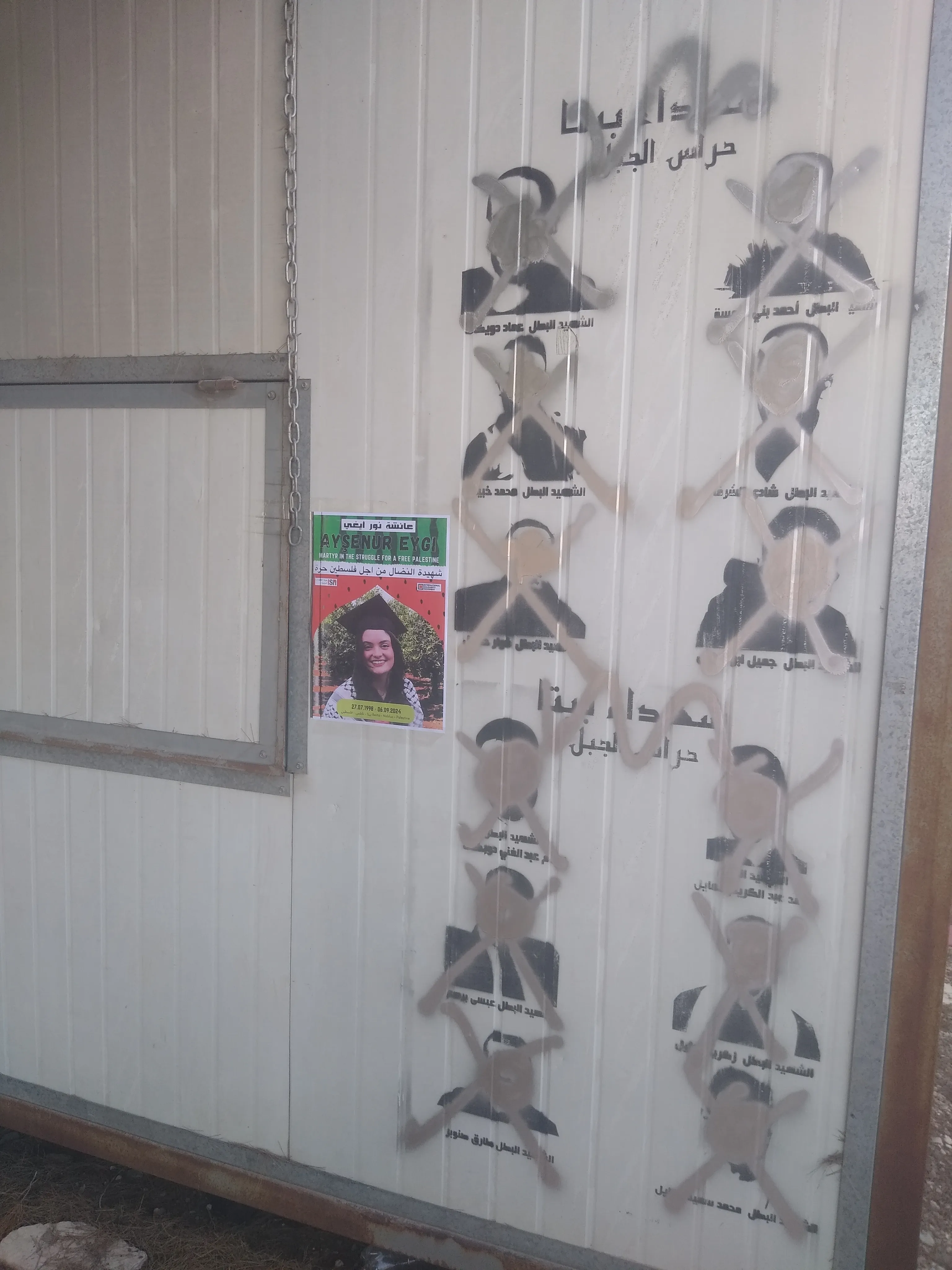 Posters of martyrs in Beita that have been crossed out by IOF soliders